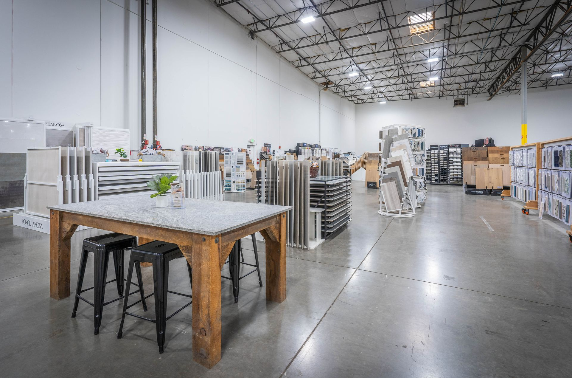 Design consultation area with tile and flooring sample displays at Nova Tile Reno showroom