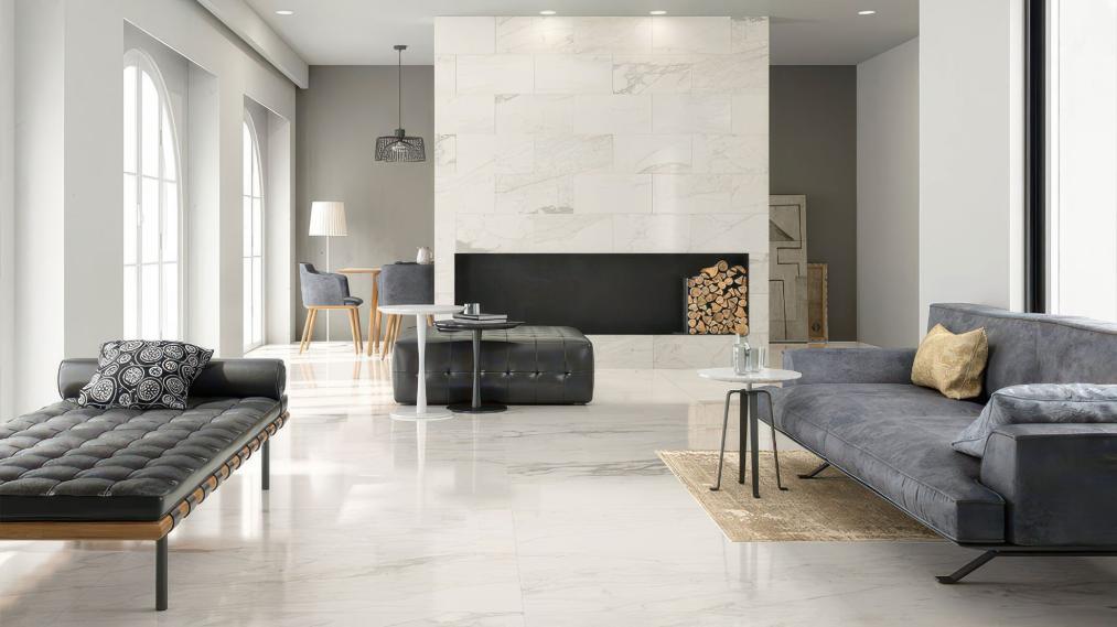 Modern living room with white porcelain floor tiles and marble fireplace wall