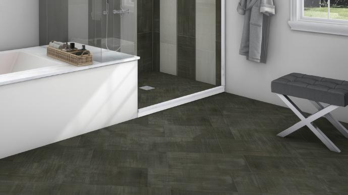 Bathroom with a walk-in shower, white bathtub, and Rustic Metallic 12x24 Textured Finish Porcelain Tile on the floor.