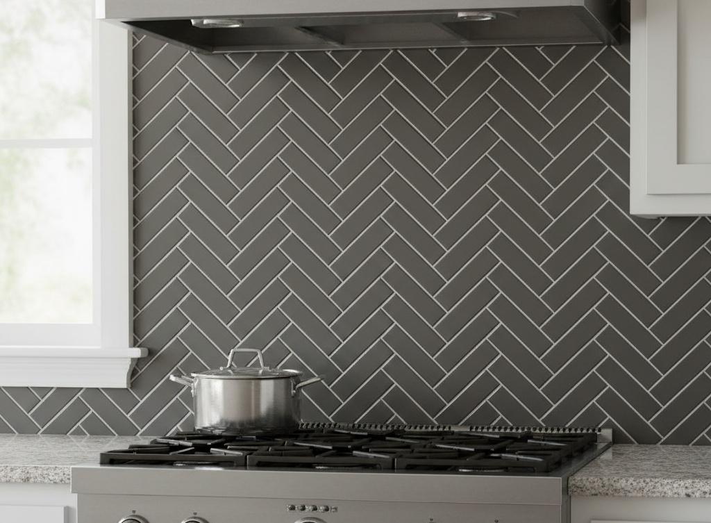 Modern herringbone subway tile pattern in matte gray finish with minimal grout lines