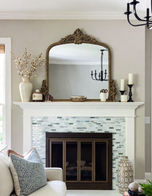 fireplace featuring light blue and white mosaic subway tiles