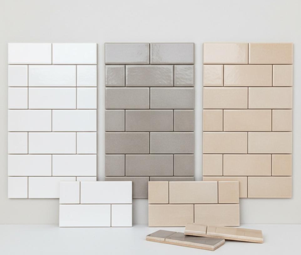 A product showcase of 3x9 subway tiles in three glossy finishes: crisp white, cool grey, and warm beige.