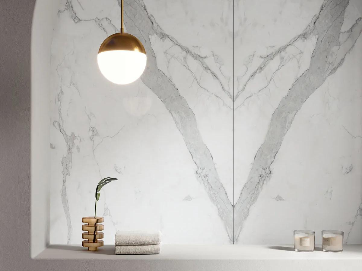 Statuario Principe porcelain slabs featured in a dramatic bookmatched wall installation
