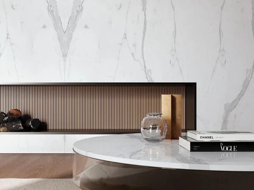 Statuario Principe porcelain slabs as a fireplace surround paired with a round coffee table
