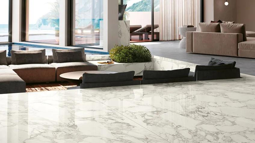 Luxury living space featuring white marble look flooring with Calacatta Magnifico porcelain slabs.