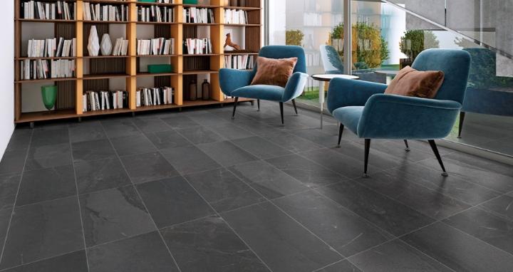 Slate look subway tile flooring with dark gray rectangular tiles laid in a horizontal pattern.