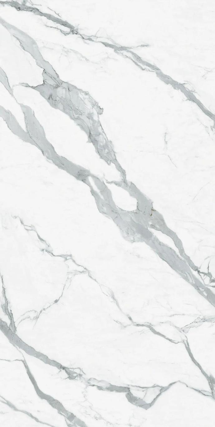 Close up of Classic Statuario porcelain slabs showing white base with bold grey veining.