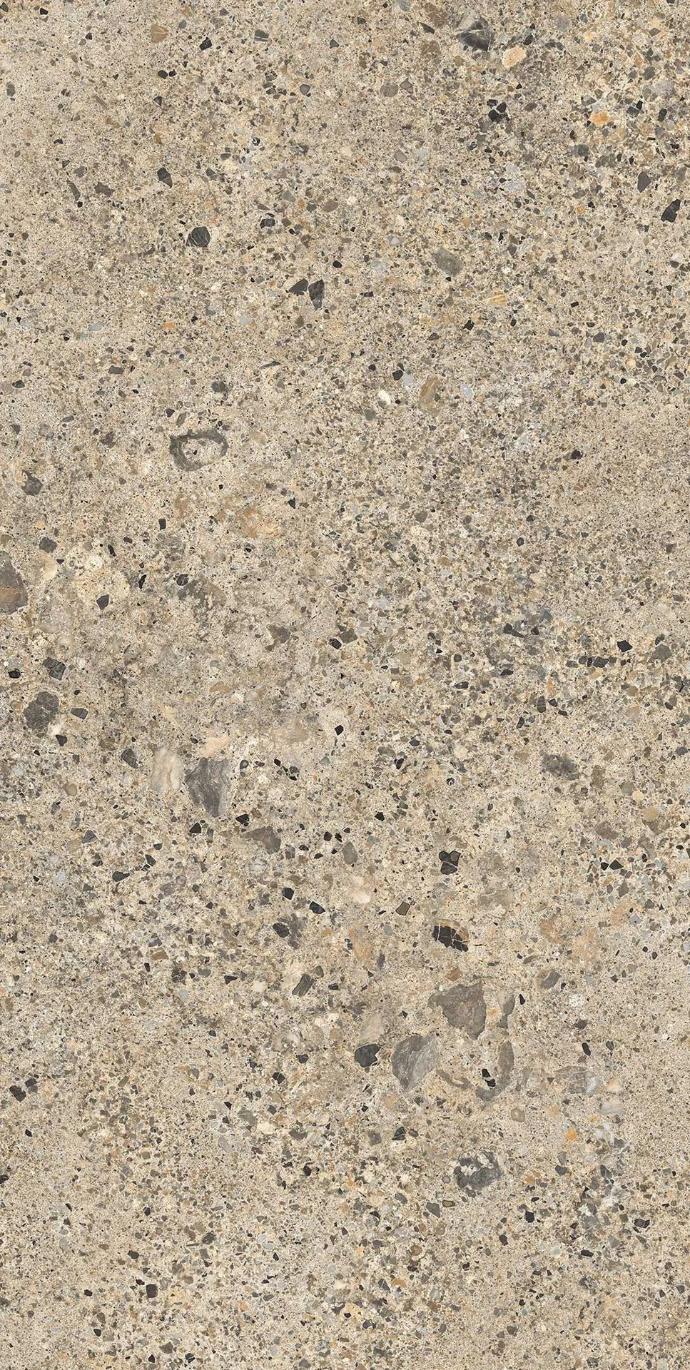 Full slab view of Ceppo Romano porcelain slabs displaying beige base with scattered stone fragments.