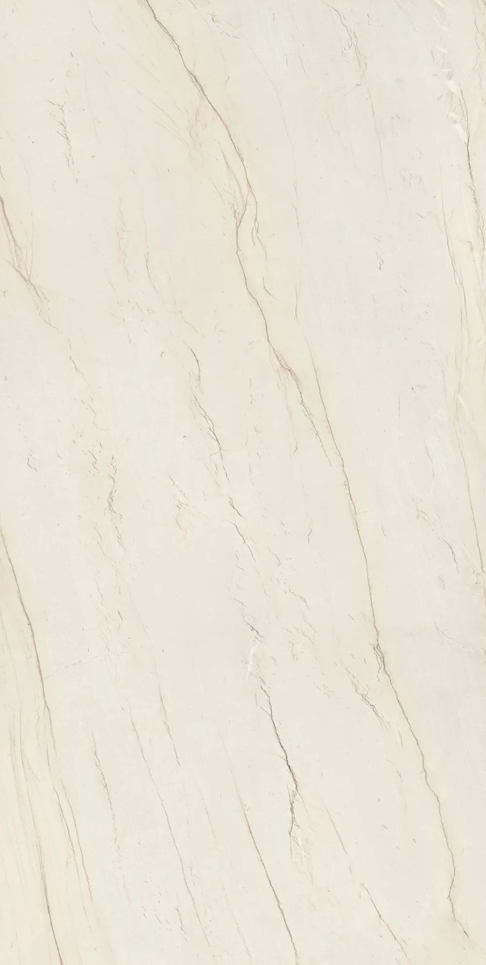 Calacatta Brasile porcelain slabs displaying delicate grey veins on pristine white surface.