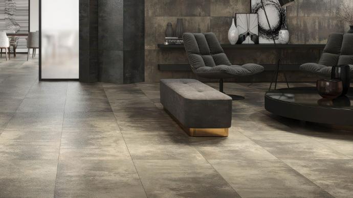 Cascade Griege 12x24 metallic look porcelain tile - room scene showing greige (grey-beige) oxidized metal finish as flooring with matching wall application in upscale interior