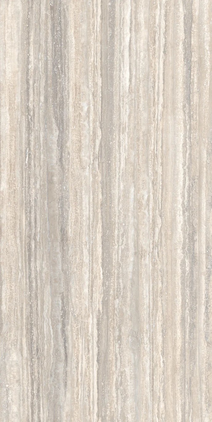 Close up of Travertino Trilogy porcelain slabs showing classic travertine look with soft grey streaks.