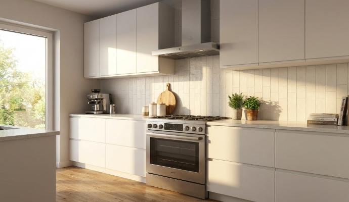 Kitchen backsplash featuring Perfection 2.5x8 matte porcelain subway tile in vertical layout with modern white cabinetry