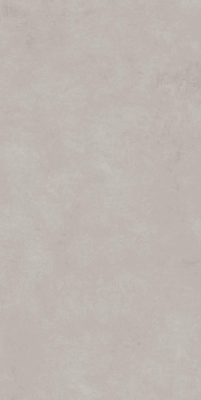 Close-up of Concrete Light porcelain slabs displaying modern cement-look surface in pale gray.