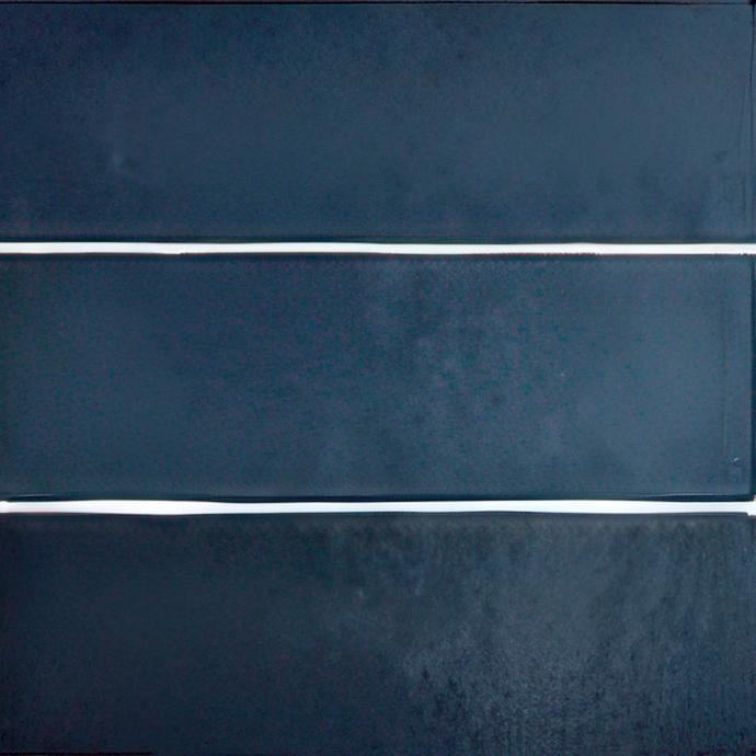 2.5x5 navy blue matte porcelain tile with white line grout.