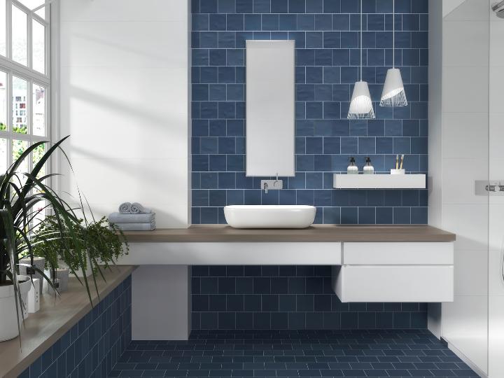 Modern bathroom featuring navy blue porcelain subway tile on walls and floor
