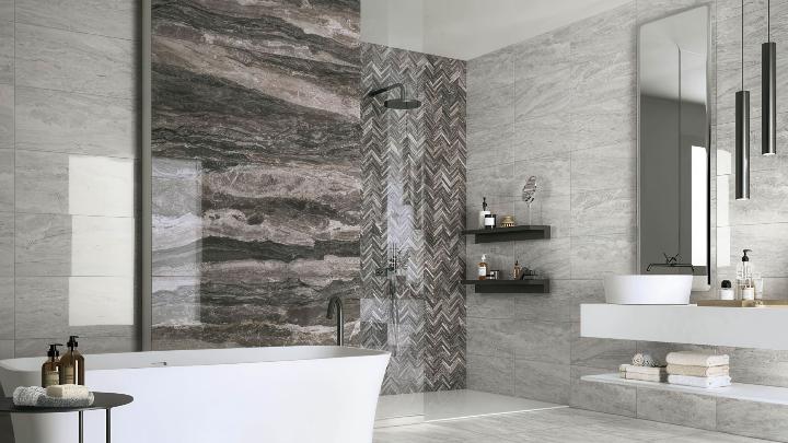 Luxury spa bathroom with gray marble-look porcelain tile wall