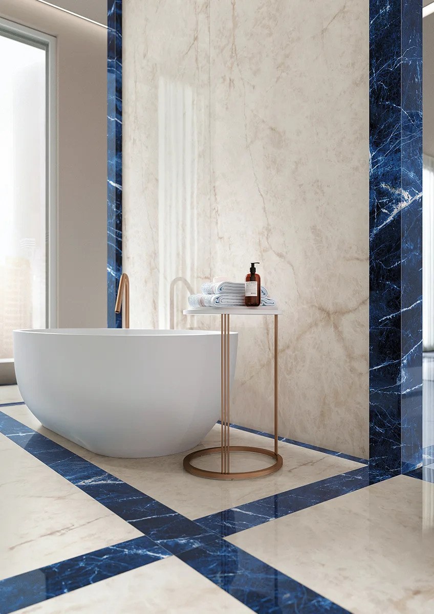 Bright bathroom showcasing Crystal Ice porcelain slabs on walls and floor with natural light.