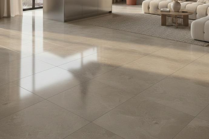 Glossy neutral-toned porcelain tiles with reflective finish in contemporary interior Polished beige porcelain tile flooring in modern living space