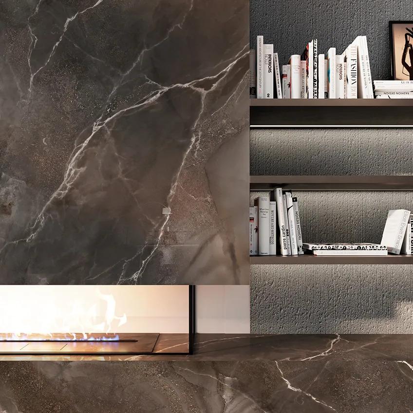 Andromeda porcelain slabs wall with built-in shelving and fireplace in living space.