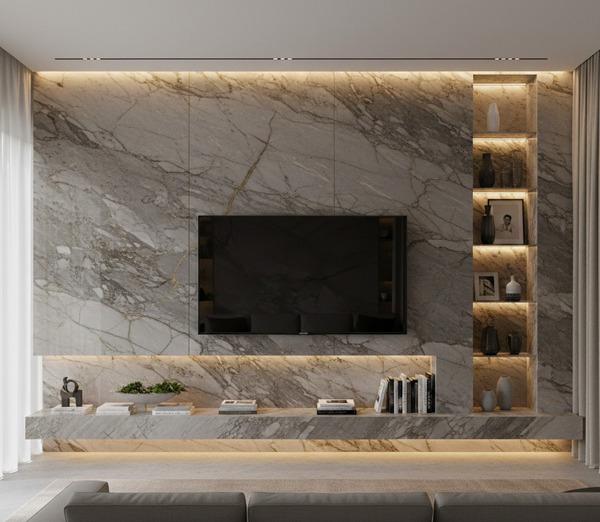 Natural stone for built-in ledges in a modern TV feature wall.
