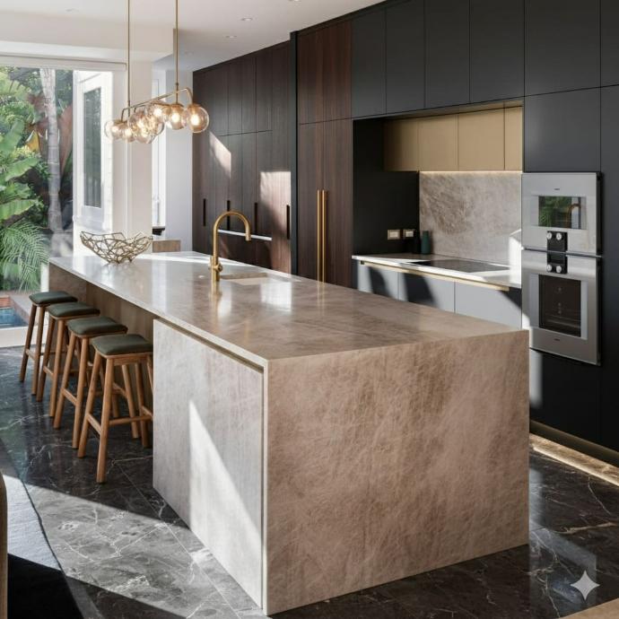 Modern kitchen featuring natural stone island with brass fixtures