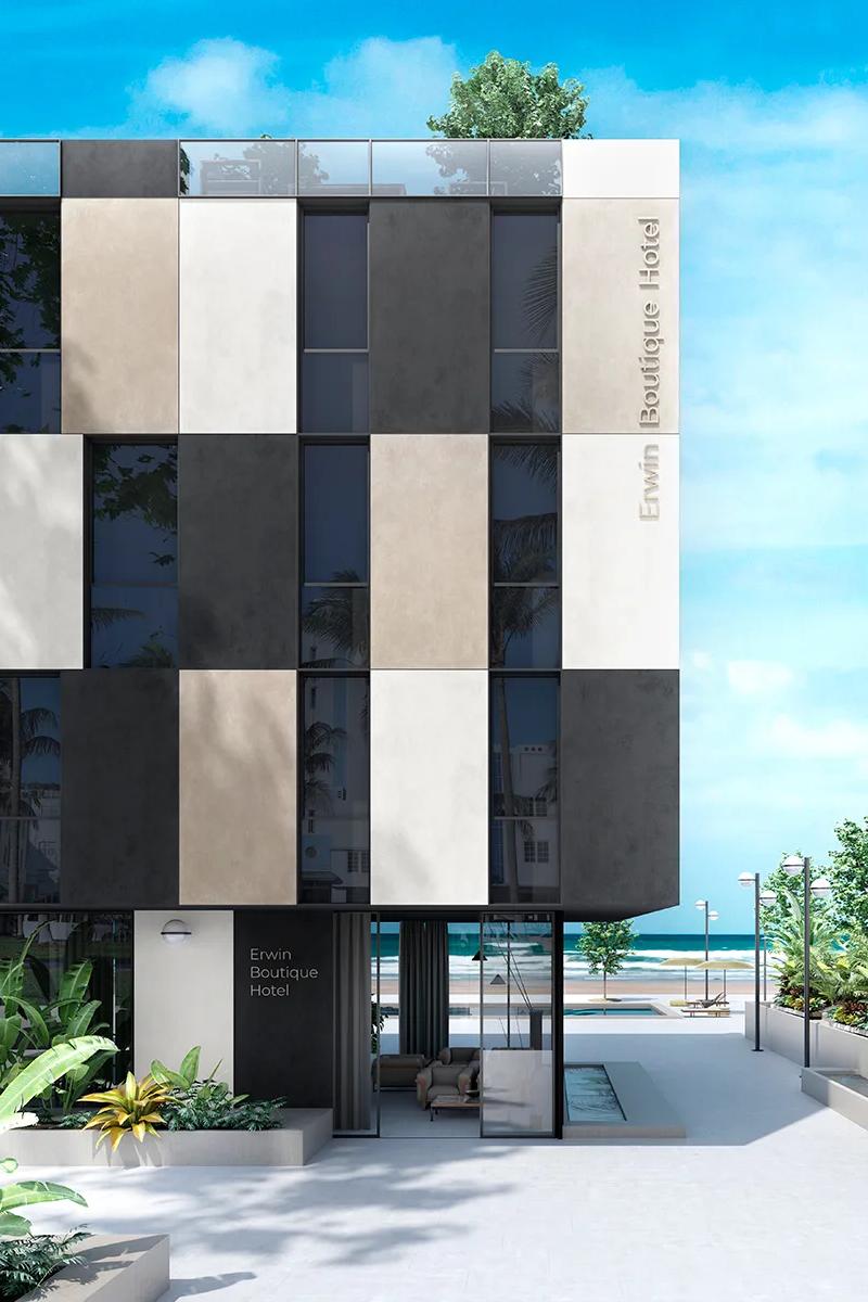 Total Grey porcelain slabs paired with dark and light panels on a beachfront building.