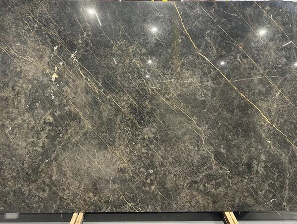 Black and gold marble slab at Nova Tile and Stone showroom
