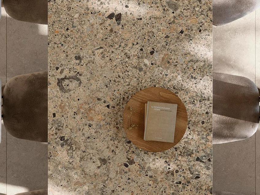 Ceppo Romano porcelain slabs surface featuring distinctive pebble stone look with warm earth tones throughout.
