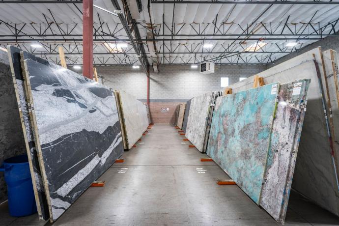 White Taj Mahal Quartzite slabs displayed in Nova Tile and Stone showroom