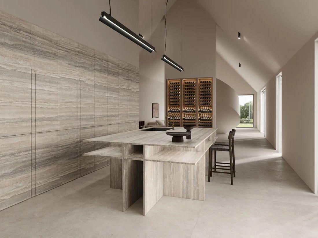 Modern kitchen featuring Travertino Trilogy porcelain slabs on walls with wine storage and island seating.