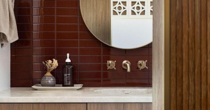 Glossy dark red wall tile bathroom backsplash with stacked pattern
