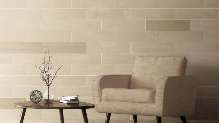 Beige subway tile accent wall in a modern living room