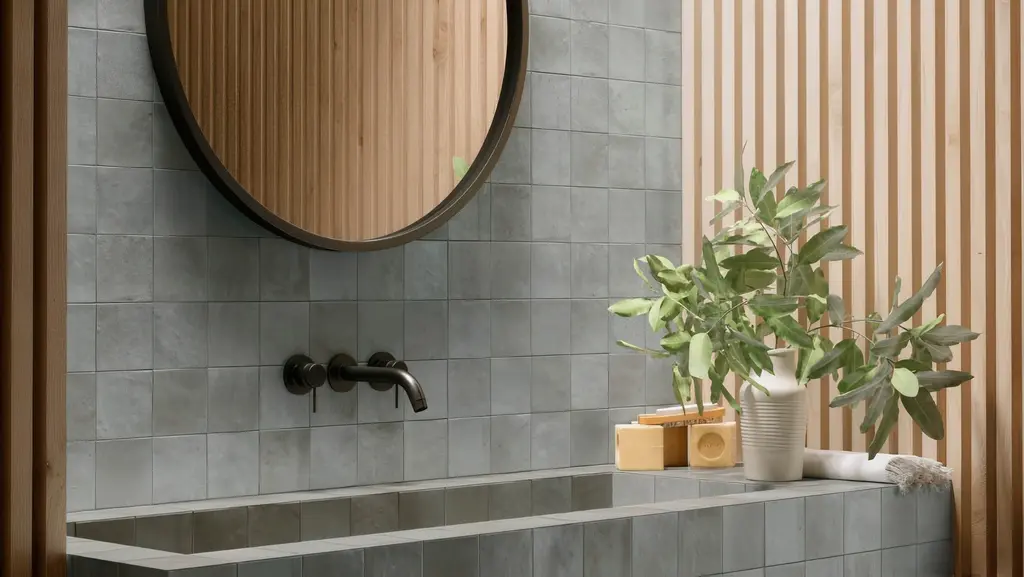 Modern bathroom vanity with soft gray square wall tile
