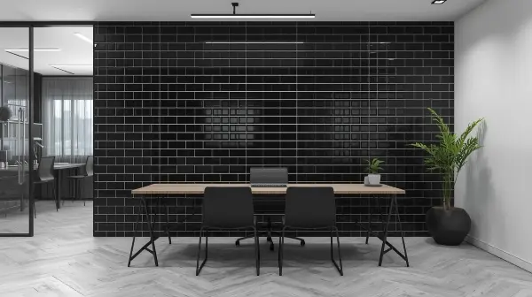 Black subway tile feature wall in a modern workspace
