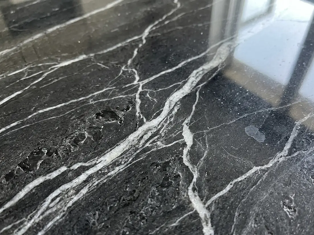 Dark Gray Graphite Marble slab close-up showing veining and polished finish detail