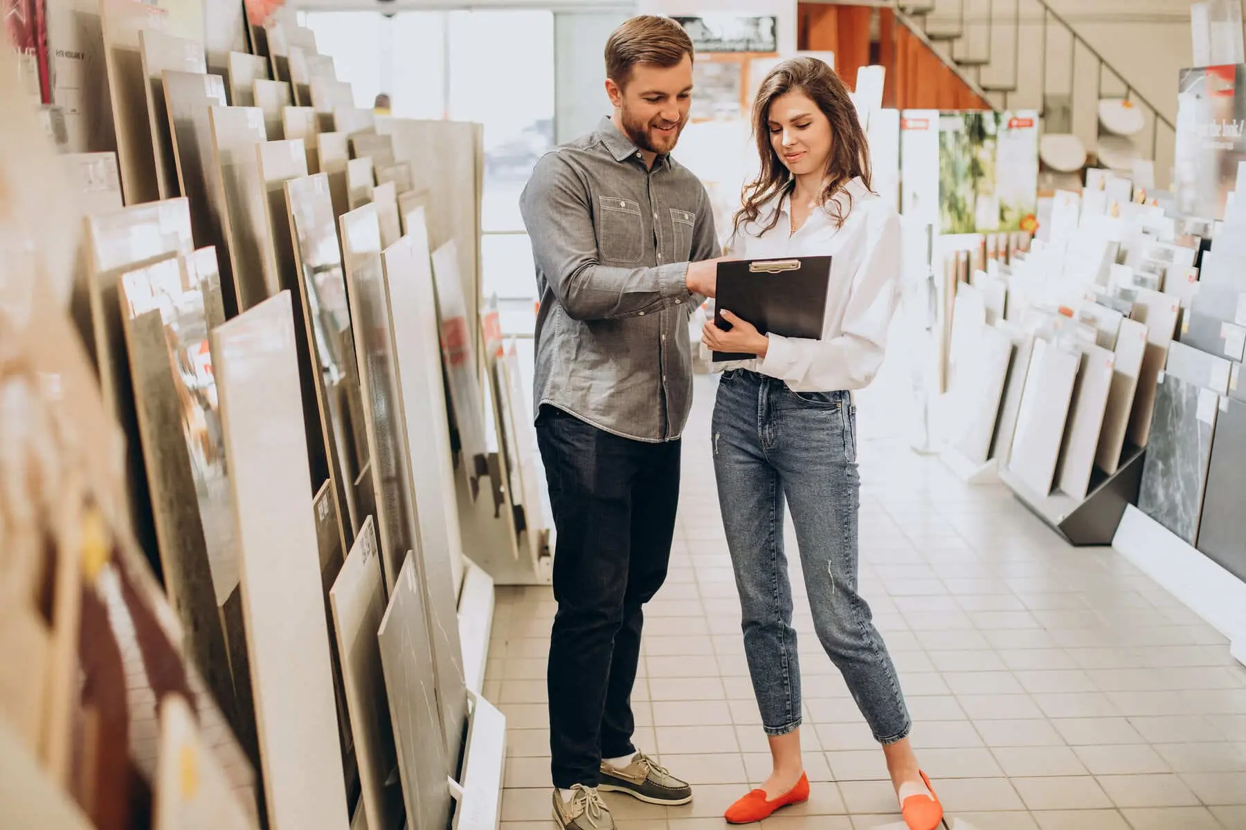 A couple selecting porcelain tile for a home renovation project